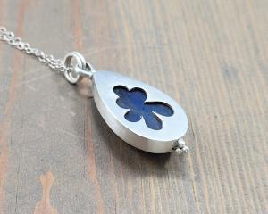 signature flower cut out on back