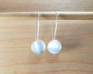 white dangle earrings