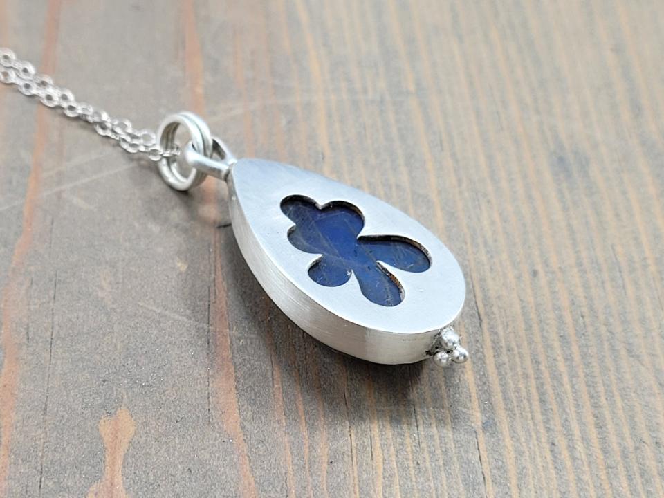 signature flower cut out on back