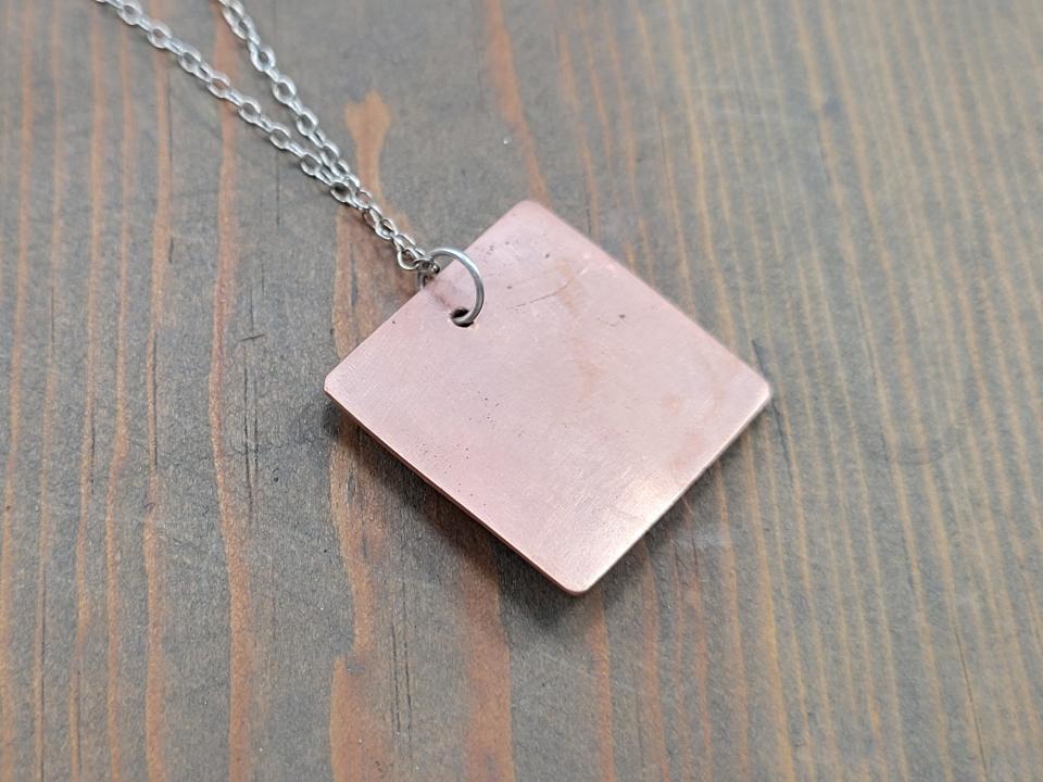 unadorned copper pendant back