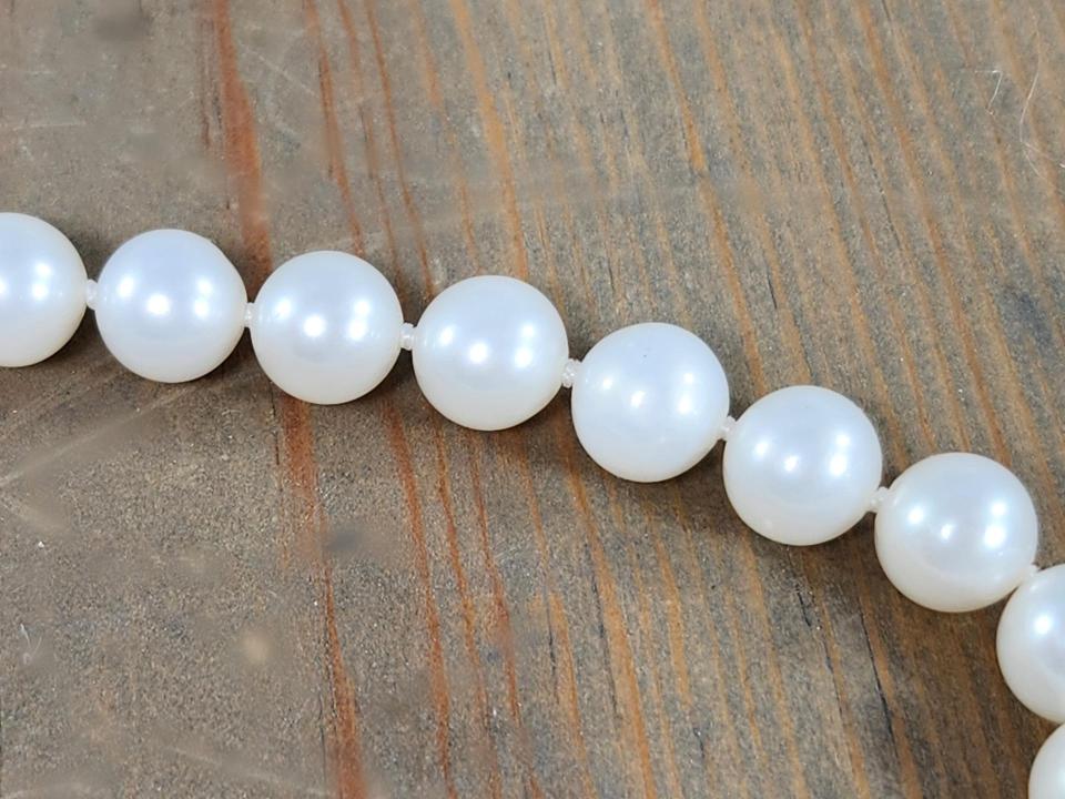 hand knotted white pearls with silk thread